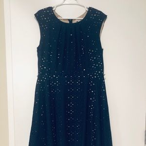 Navy cap sleeve dress with cream under layer.